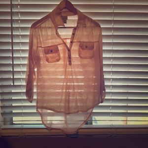 Woman’s pale coral blouse